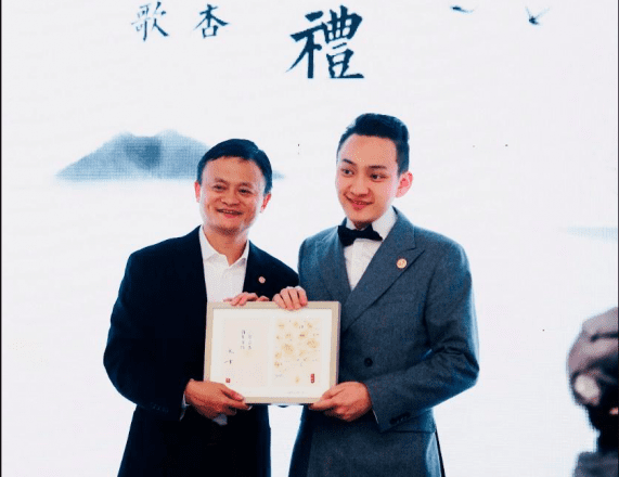 Two Men Taking a Photo Holding a Degree
