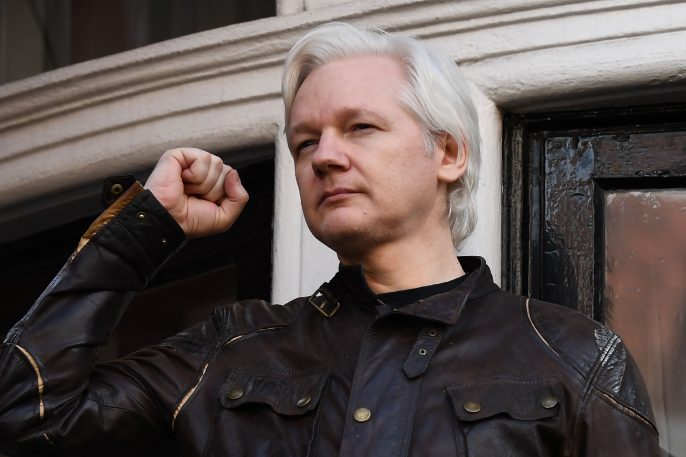 Julian Assange raising fist
