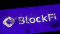 Golden BlockFi and Coinbase logo.