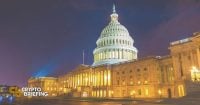 The U.S. Capitol building illuminated at night, supporting an article about a senators' bill amendment related to cryptocurrency regulation.