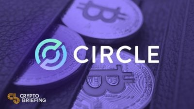 "Circle logo overlaid on an image of Bitcoin coins, partially visible from a leather wallet, promoting blockchain technology."