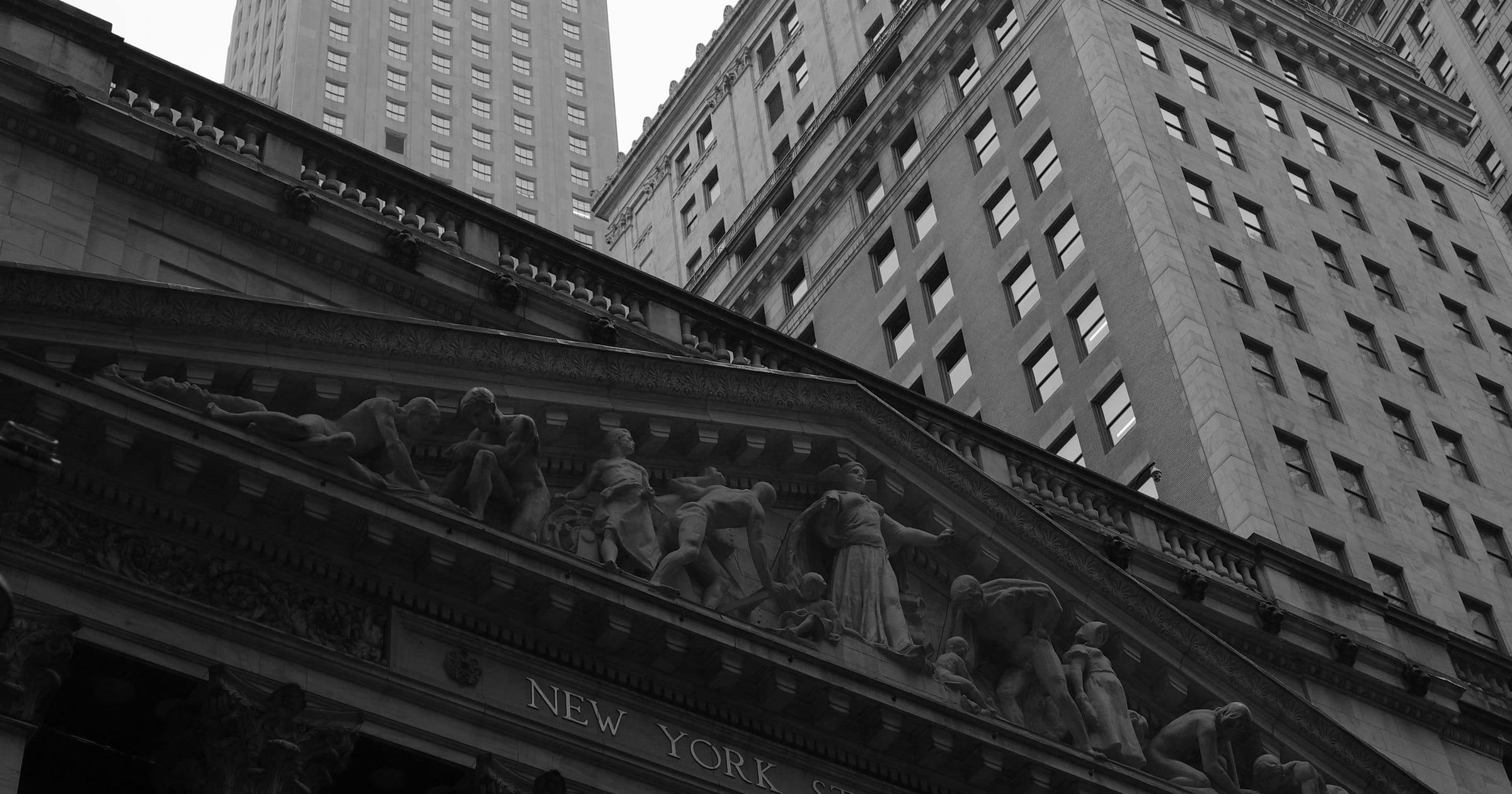 Dow hits record high as NASDAQ 100 falls 2% on chipmaker weakness