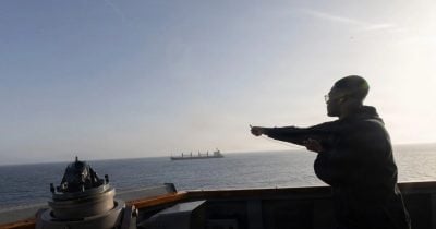Iran strikes ships in Strait of Hormuz as deal signing looms