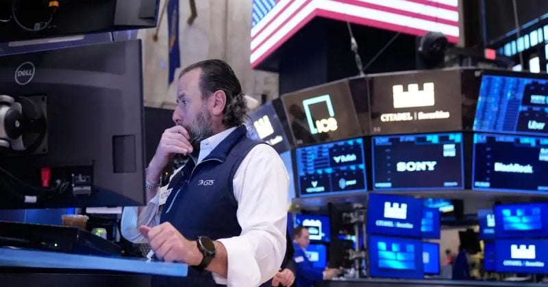Dow closes sharply lower, Nasdaq posts modest gain amid US-Iran tensions