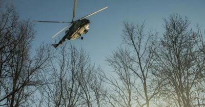 Russian soldier loses control of helicopter cannon, flies through air