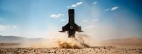 Powerus Guardian interceptor launching over desert terrain.